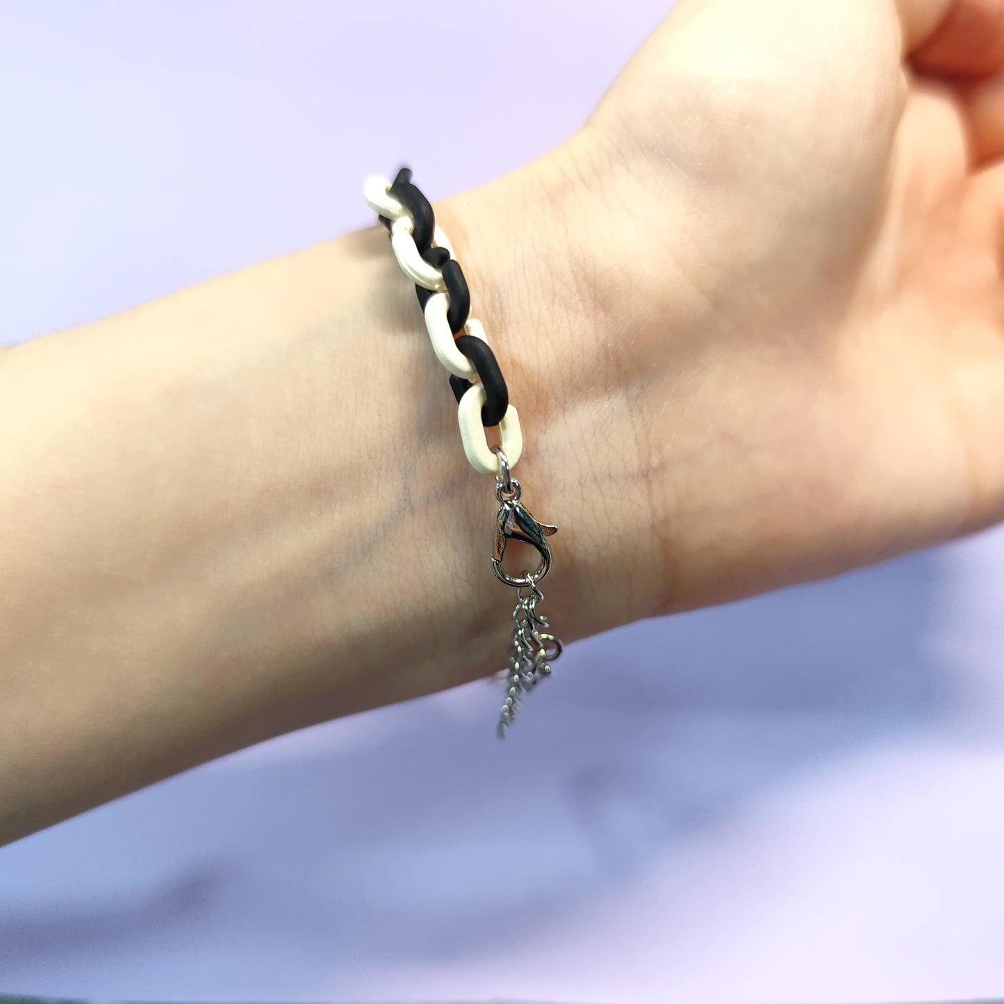 Set of three bracelets with cute bear charms in black, pink and white. Color - contrasting chains make them trendy and charming.