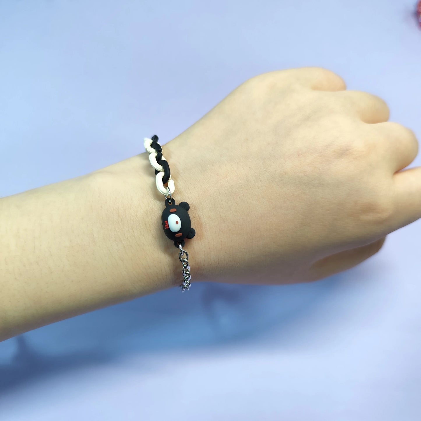 Set of three bracelets with cute bear charms in black, pink and white. Color - contrasting chains make them trendy and charming.