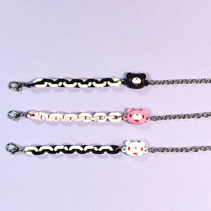 Set of three bracelets with cute bear charms in black, pink and white. Color - contrasting chains make them trendy and charming.