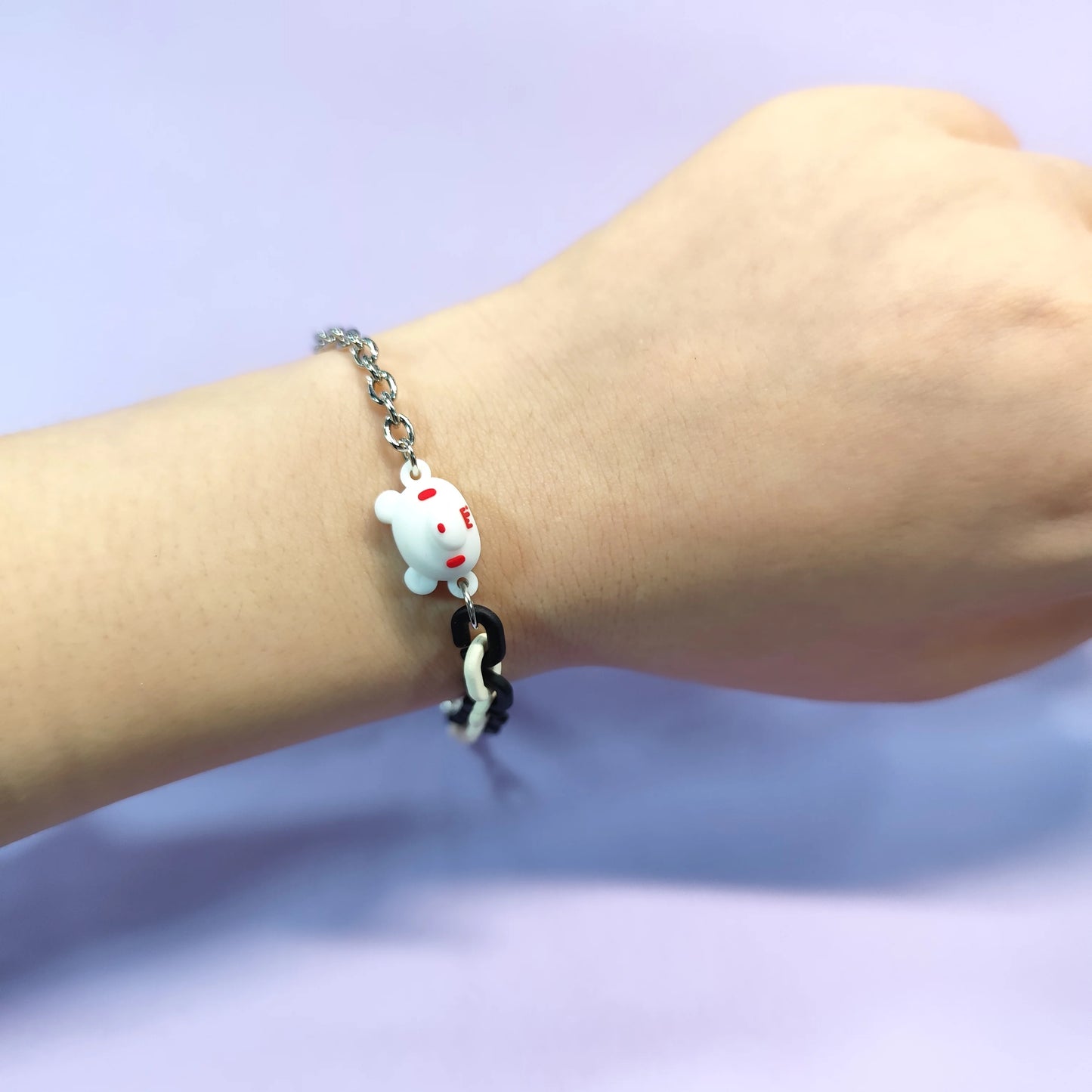 Set of three bracelets with cute bear charms in black, pink and white. Color - contrasting chains make them trendy and charming.